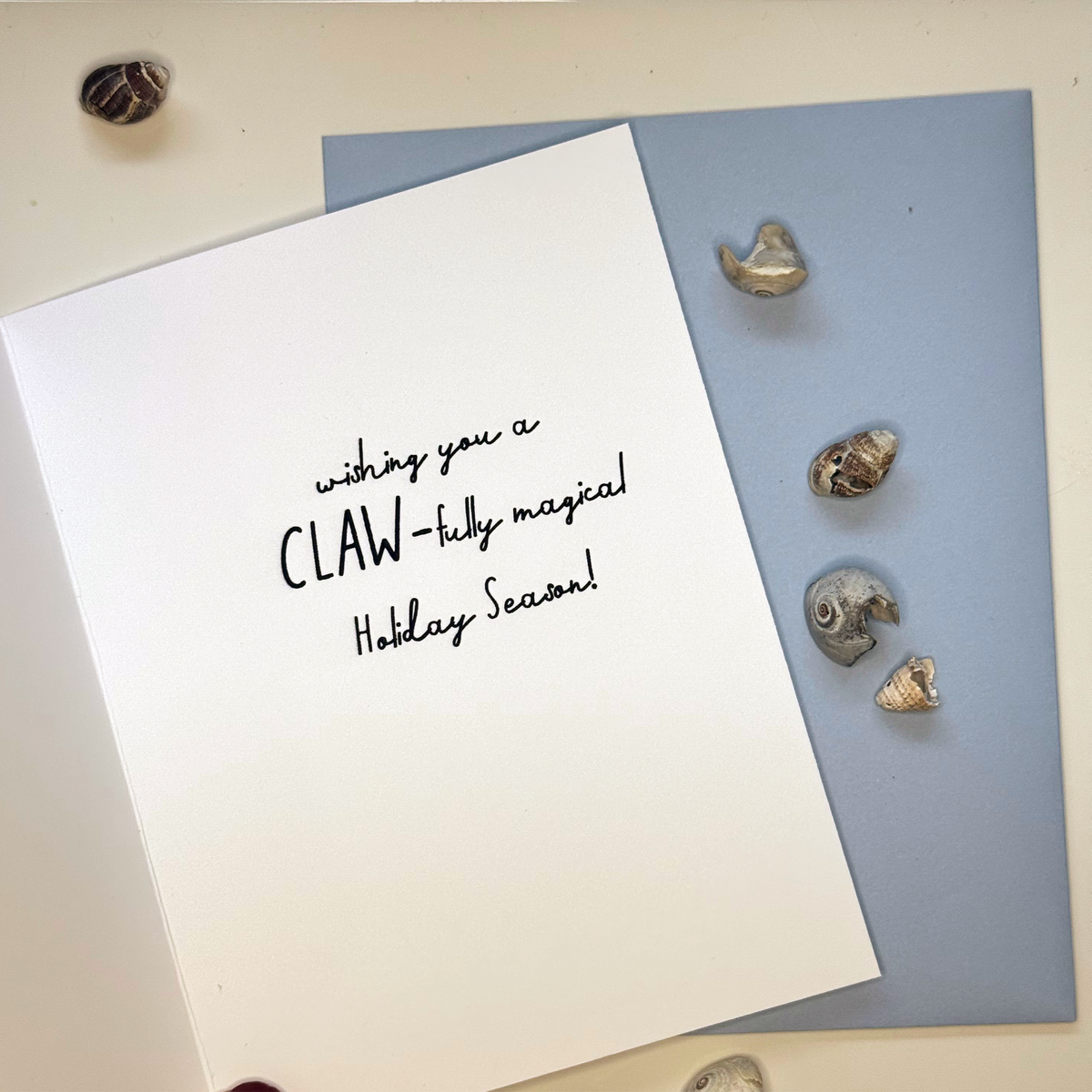 Inside of lobster Christmas card reading wishing you a claw-tully magical holiday season