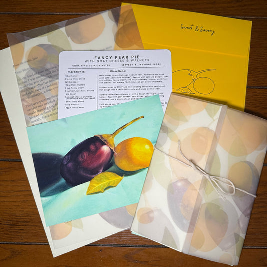Flat lay of the Sweet & Savory Print Club monthly envelope — a handwritten letter on cream paper, a 5 by 7 original oil painting print, and a recipe card with original art