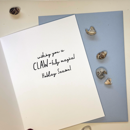 Inside of lobster Christmas card reading wishing you a claw-tully magical holiday season
