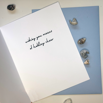 Inside of Festive as Shell mussel Christmas card reading wishing you oceans of holiday cheer